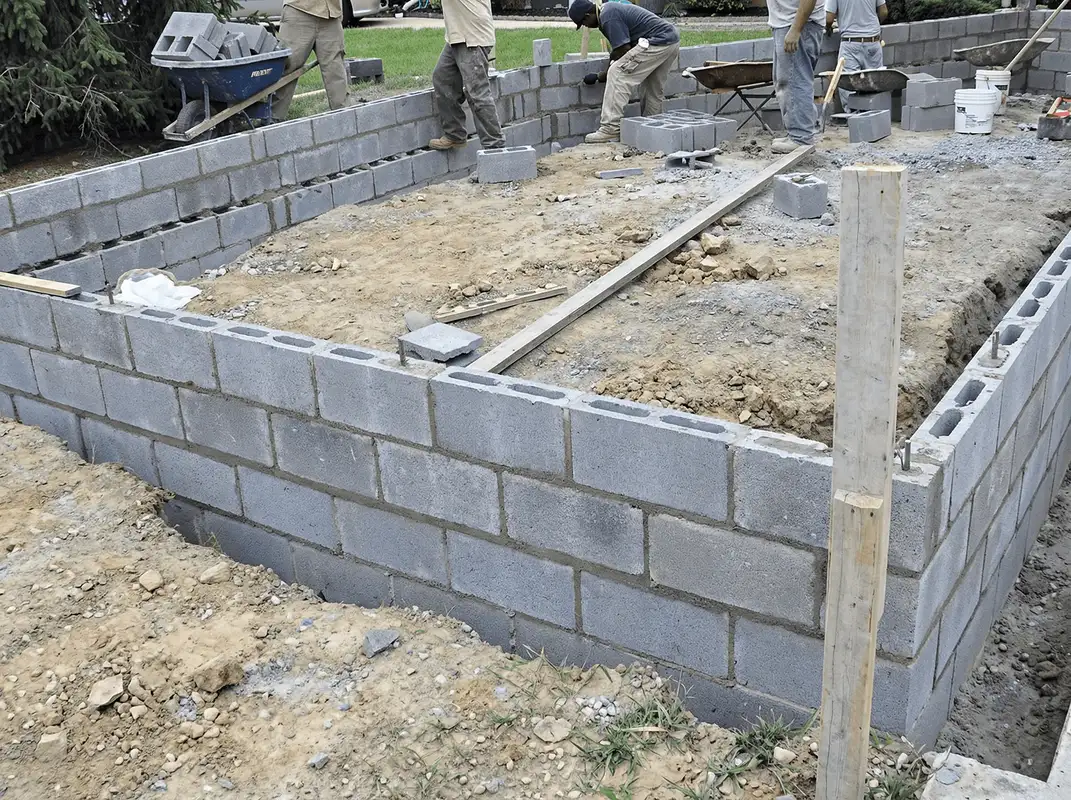 Professionals building a foundation with blocks in Fort Collins, CO