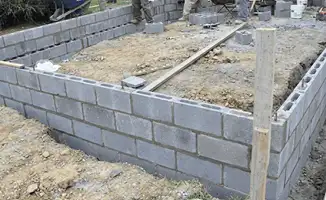 Professionals building a foundation with blocks in Fort Collins, CO